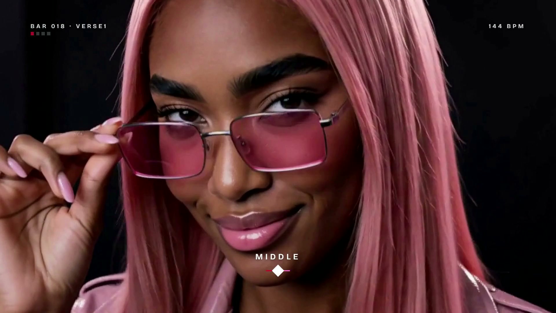 Bubblegum lowering pink sunglasses and smiling